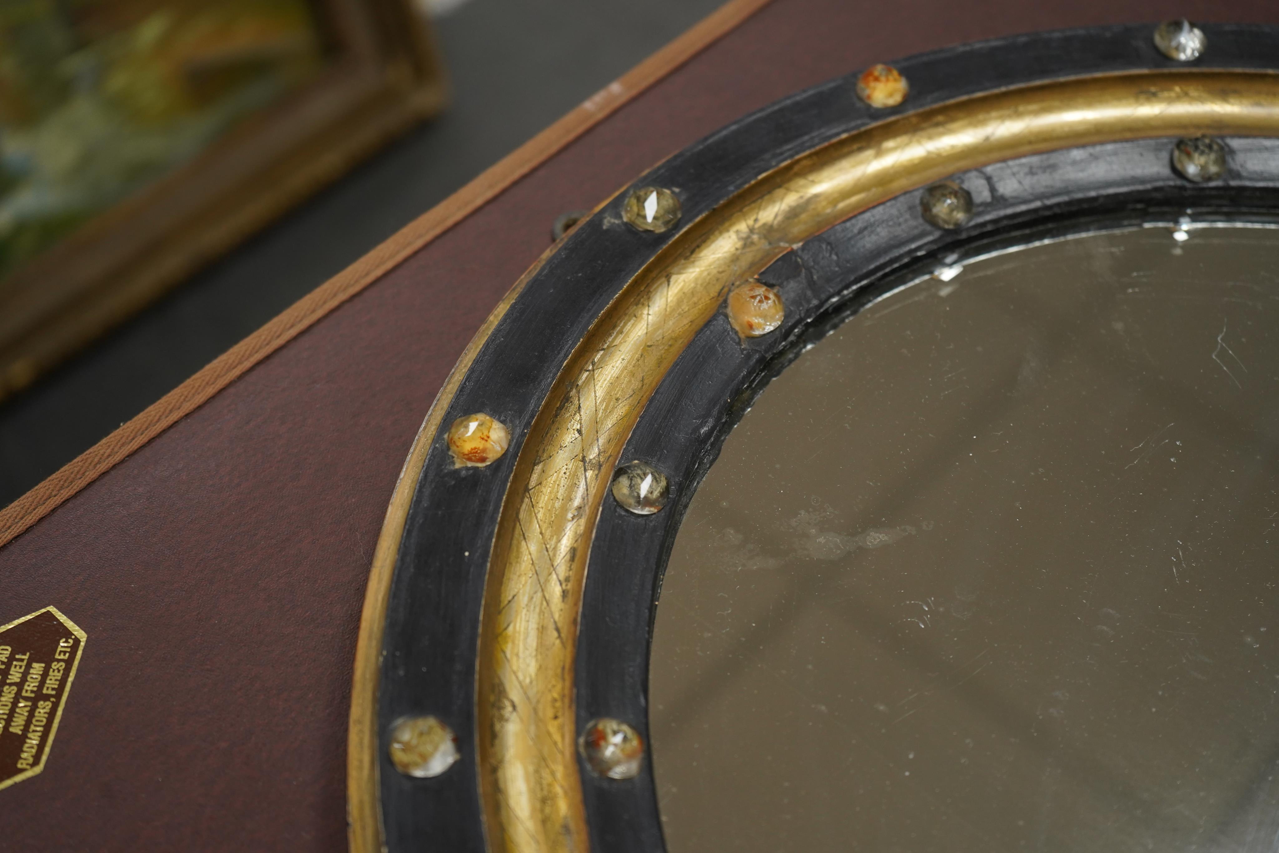 A 19th century oval Irish wall mirror, width 54cm, height 62cm. Condition - fair